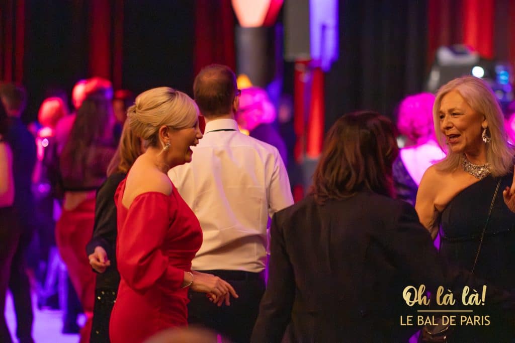 Elegant partygoers laughing